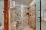 Master bathroom with tub and separate shower